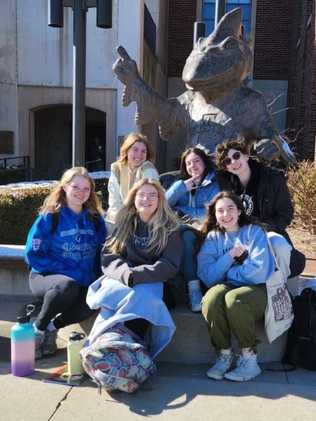 Members of the One Act play Antigone, Norah Webber, Anna Vavricek, Charlie Krob, Lillian Bishop, Ashlynn Carter-Shook, and Claire Nydegger, pose in front of Cy the Cardinal at Iowa State on Saturday. 