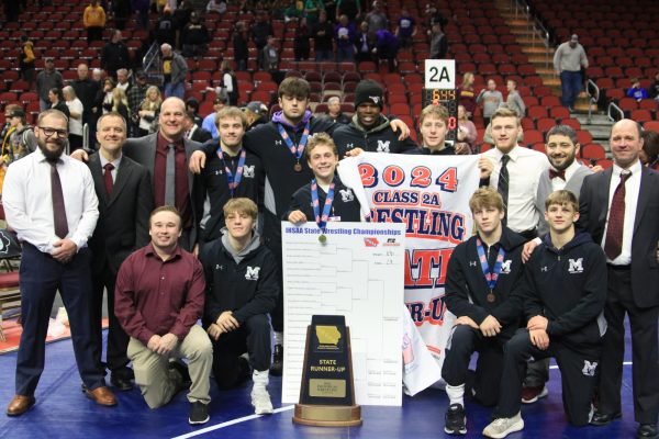 The state wrestlers pose with their newly won 2nd place trophy.