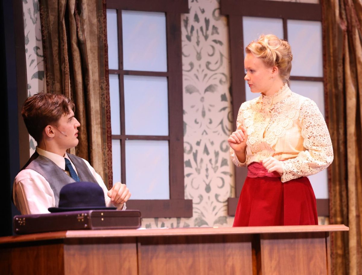Junior Cyrus Johnson and sophomore Emma Hoffman as Mr. and Mrs. Banks have a tense conversation. 