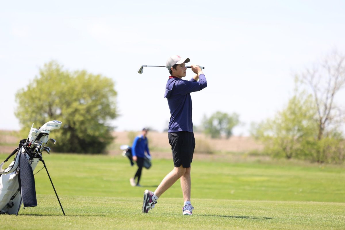 Freshman Stratton Ellyson holds his follow through after a wedge shot into the 15th green during the WAMAC Conference meet on Monday, May 6th. 