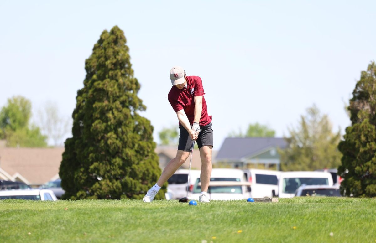 Senior Joey Rhomberg makes contact with his drive on the first hole at the WAMAC Conference meet Monday, May 6th. 