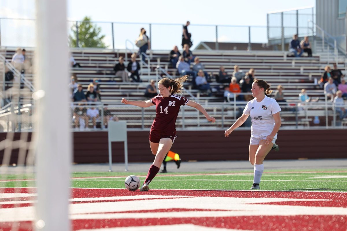 Junior Clare Nydegger (14) takes a shot on goal on Tuesday May 7th against West Delaware. The Mount Vernon girls soccer team ended the game short with a 10-0 victory. 
