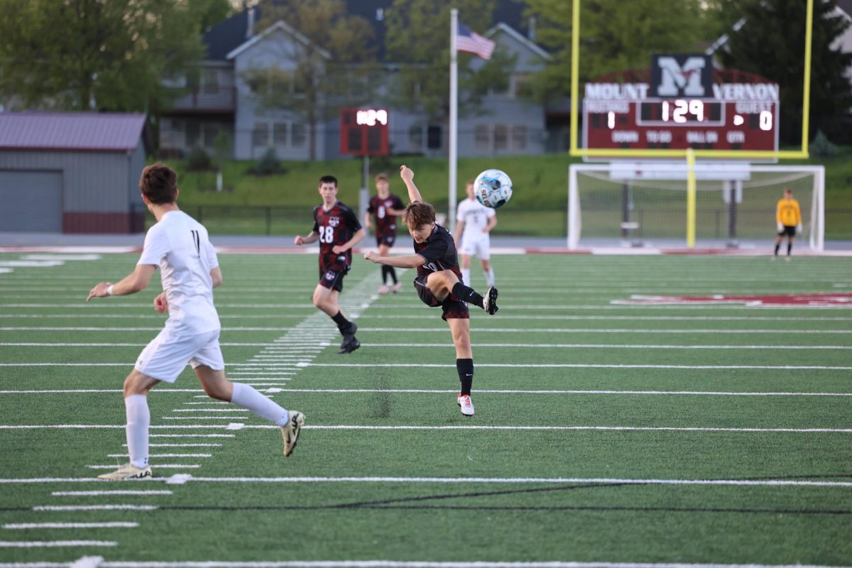 Carter Gadberry (18), a freshman from Lisbon, shoots at the goal on May 7th against West Delaware. 