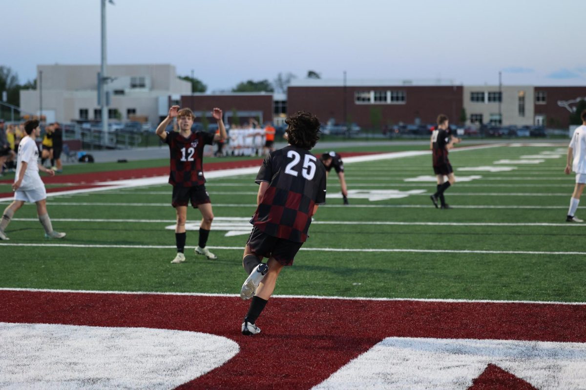Sophomore Jaxon Anderson (25) runs back to his teammates after scoring his second goal of the night against West Delaware on May 7th. 