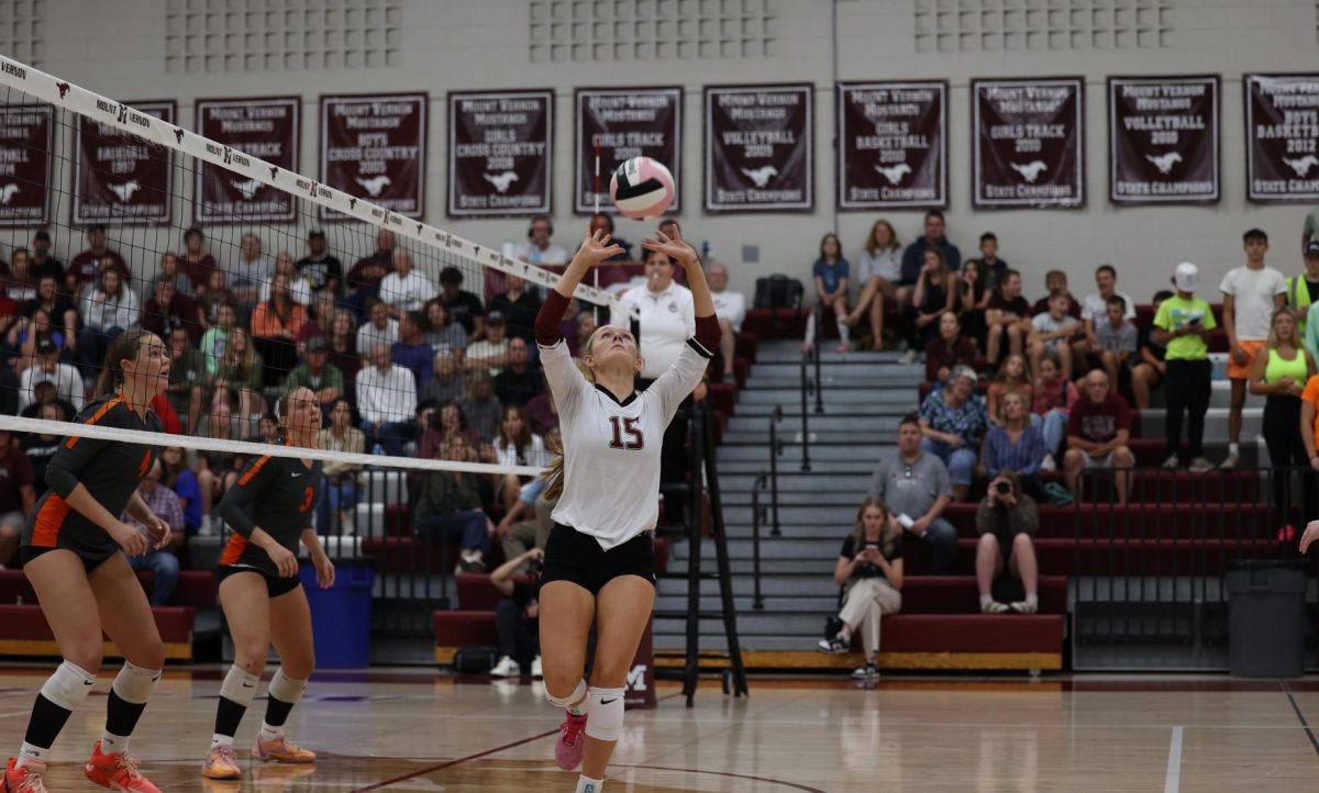 Senior Sydney Huber (15) focuses on setting the volleyball Sept. 10.