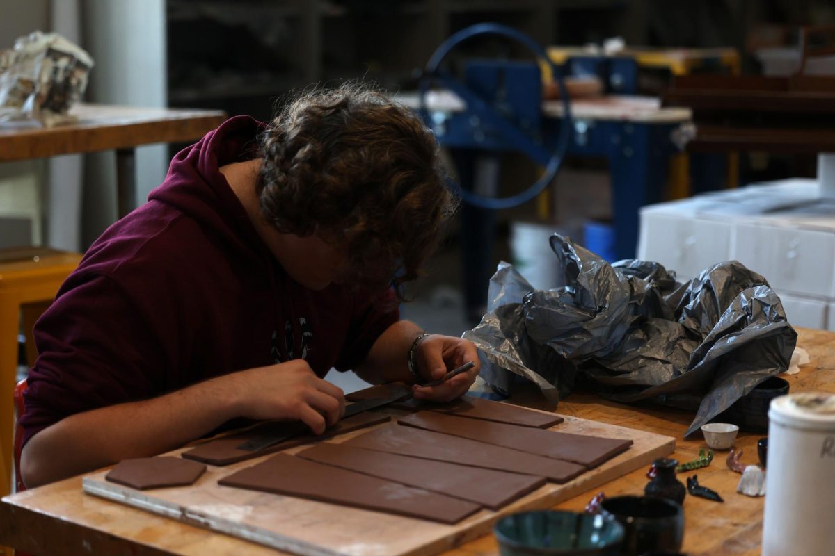 Senior Ethan Hunt is making a ceramic pot in Ceramics 3 on Sept. 11th.