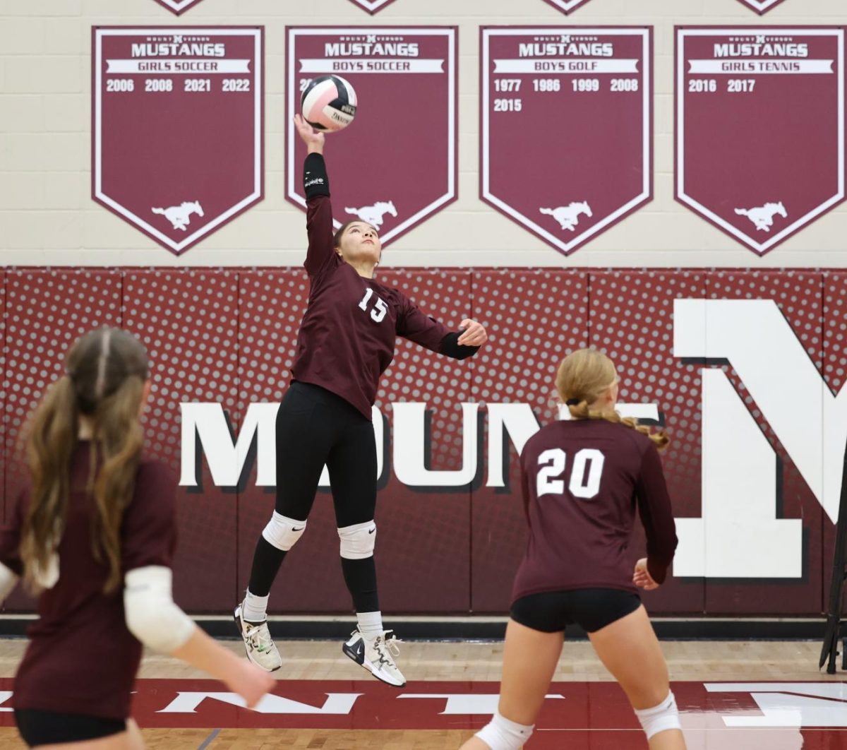 Freshman Liliana Grosse pases ball back over net to CPU on Sept. 24th.