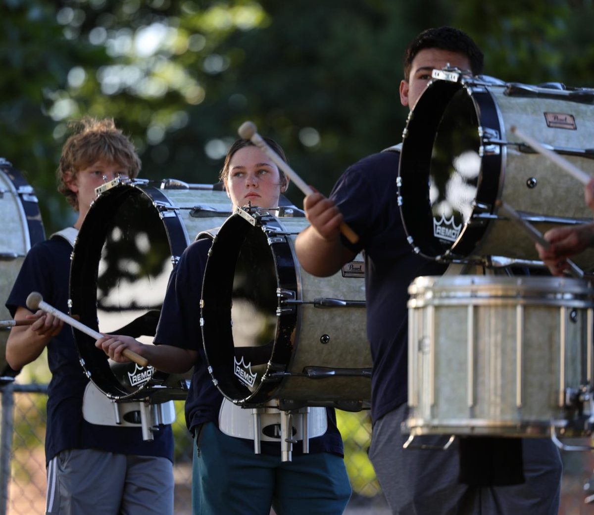 Senior Annah Schultz practices with the drum line before performing in the Hoco Parade. 