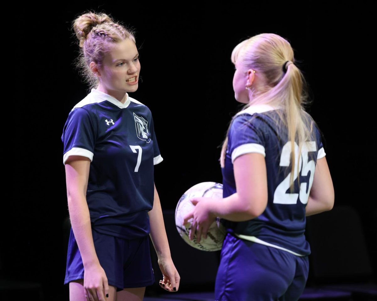 Junior Allie Teague (7) sneers at the team captain Korah Jo Robinson (25) during an argument. 