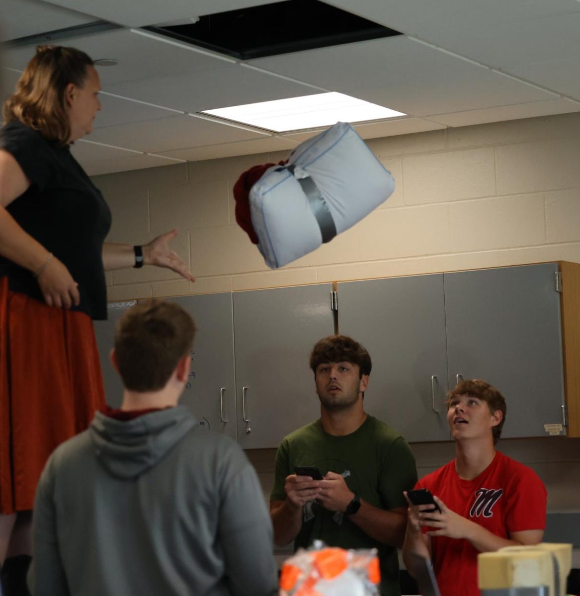 Seniors Ethan Wood and Garet Swartzendruber time the speed of each egg drop project on Sept. 5.