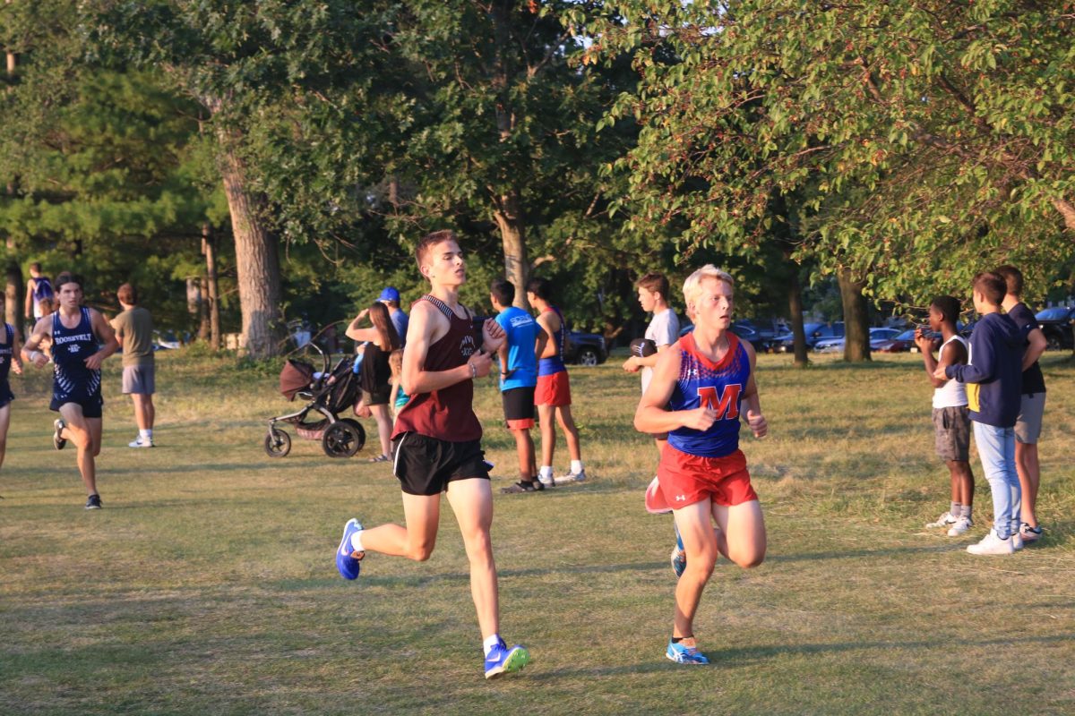 Senior Graham Vavricek runs against an opponent at the Ames meet Sept. 5. 