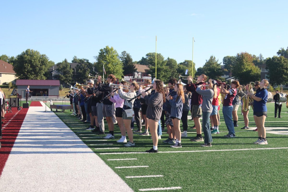 The marching band stands at a company front Sept. 6. 