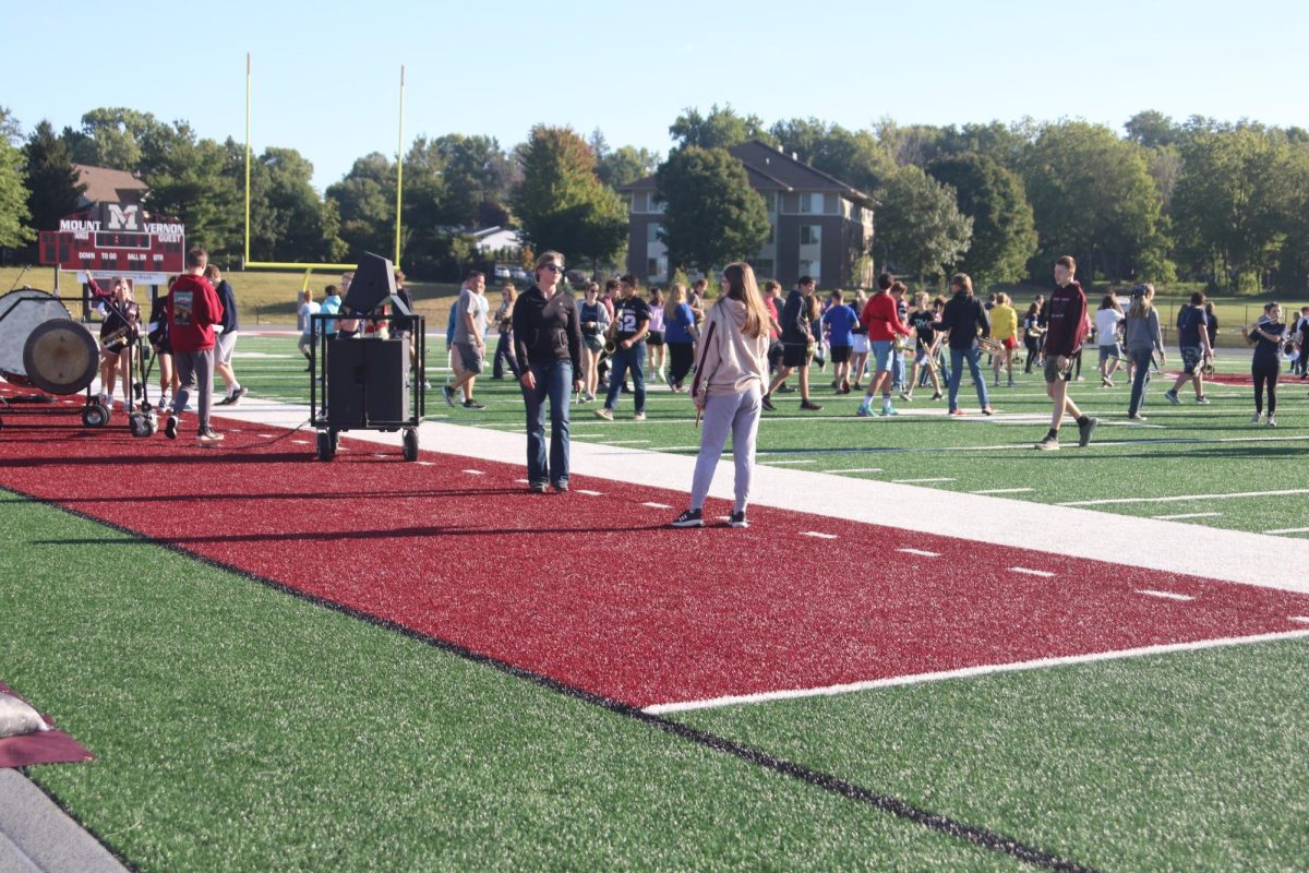 Seniors Selah Loyd and Lauren Hepker chill out before setting Pre-Game Sept. 6.