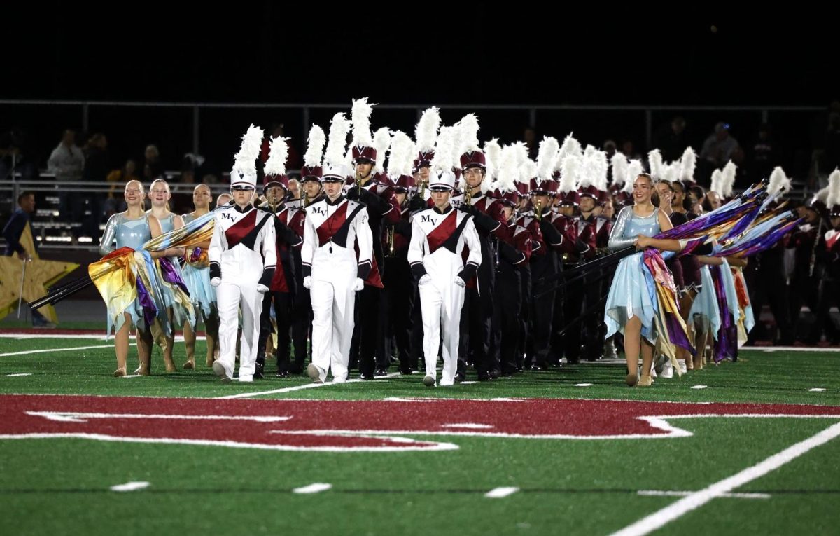 The Marching Mustangs enter the field for their first football halftime performance of this year's show 'Among the Stars'. 