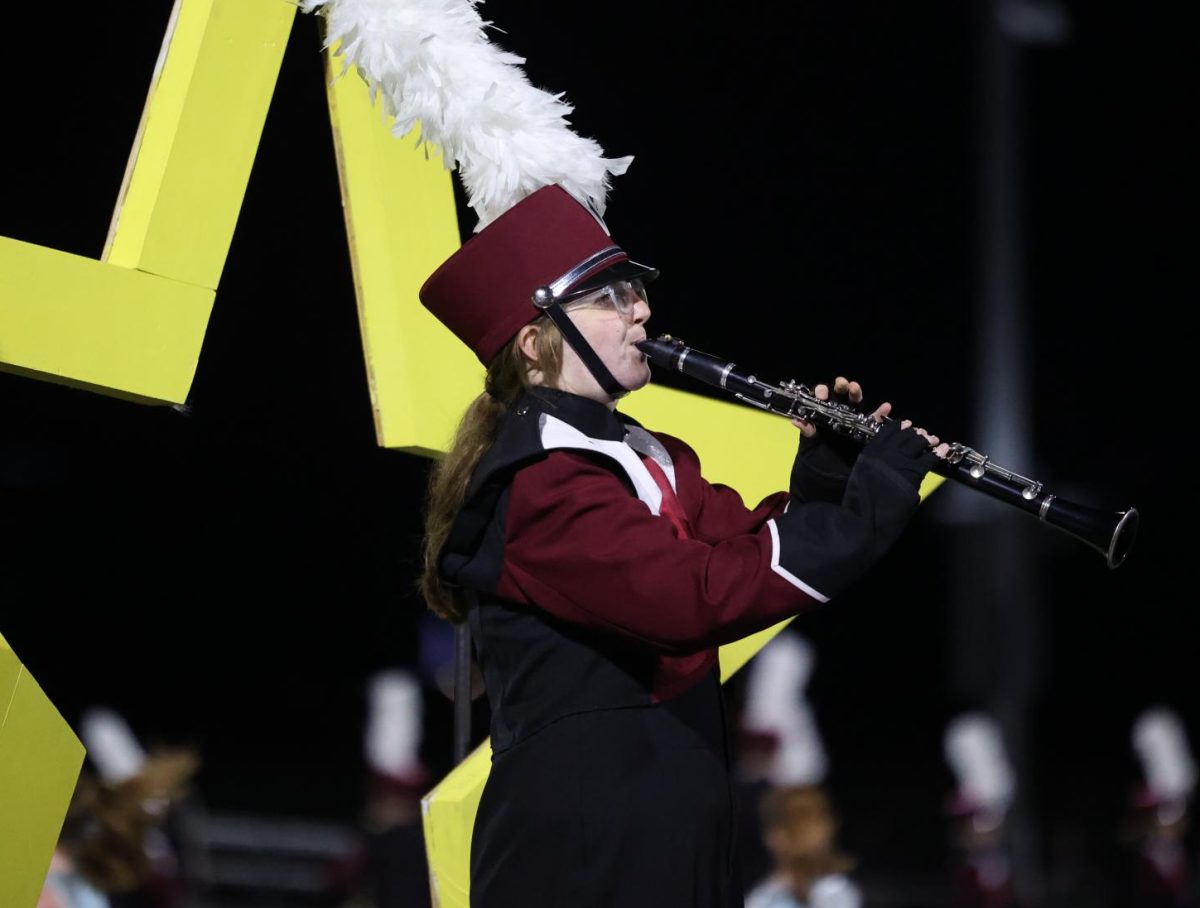 Junior Willa Turner performs a solo during the Marching Mustang's show on Sept. 6.