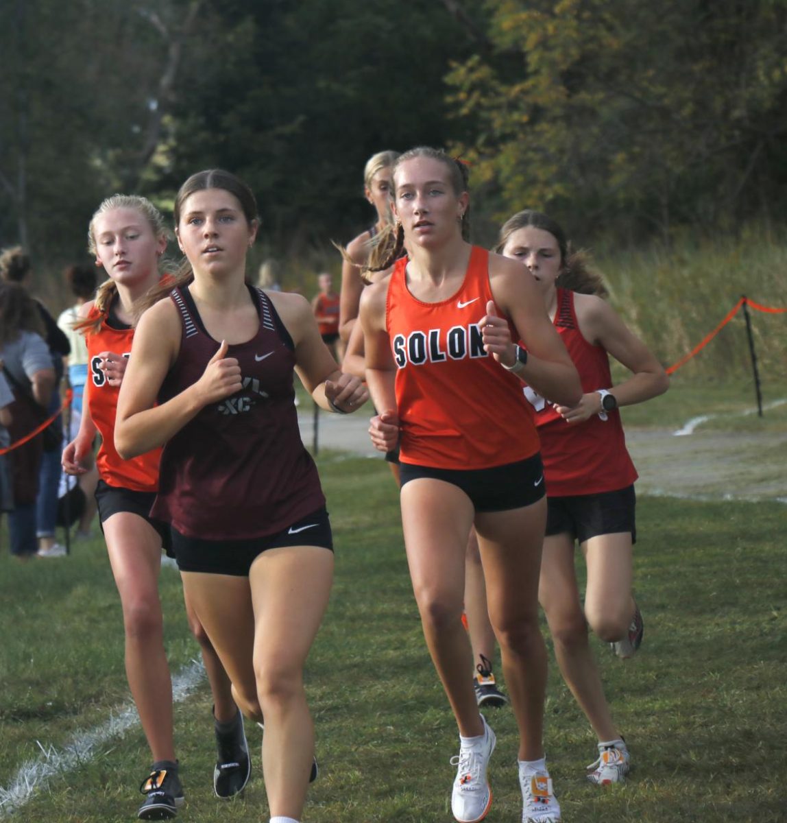 Junior Kiersten Swart runs ahead of Solon girls in the Solon meet on Sept 23. 