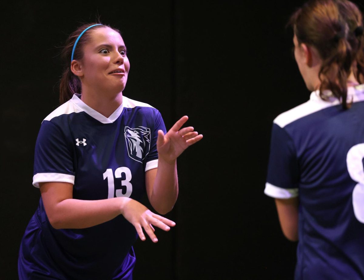 Senior Renee Vig (13) taunts her teammate during a rehearsal for 'The Wolves' on Sept. 3.