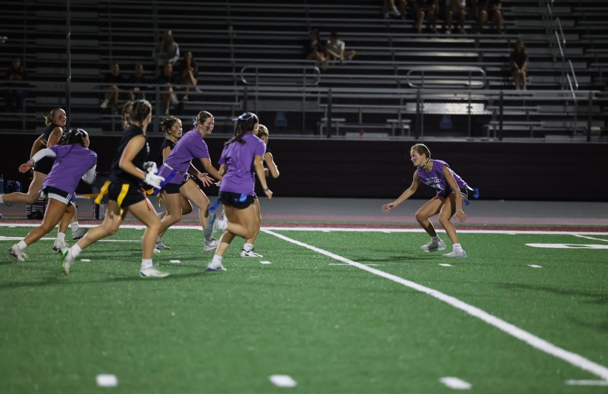 Sophomore Nora Dye gets ready to block junior Taylor Frank from making it to the end zone Sept. 26. 