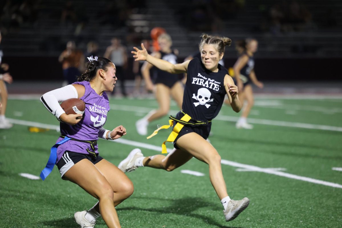 Senior Kara Swantz tries to avoid junior Kiersten Swart as she tries to block her Sept. 26. 