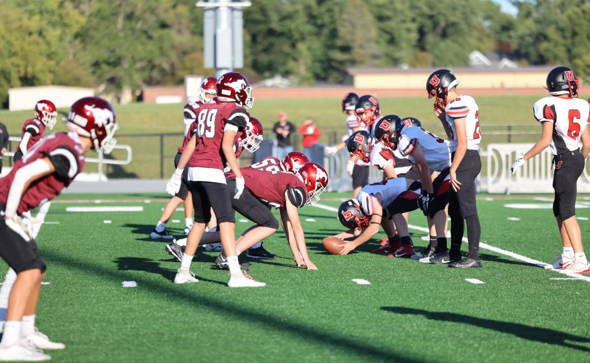 Mustang defensive line readies for a play against Union on Sept. 6.