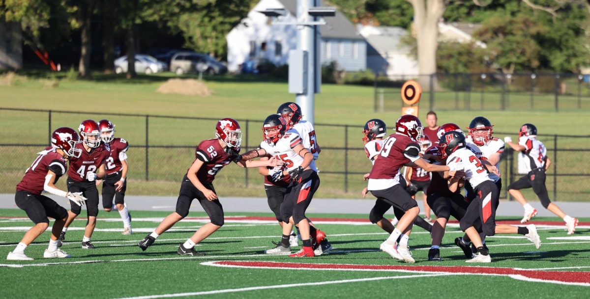 Mustang defense attempts to block a run by a Union player during the Sept. 6 game.