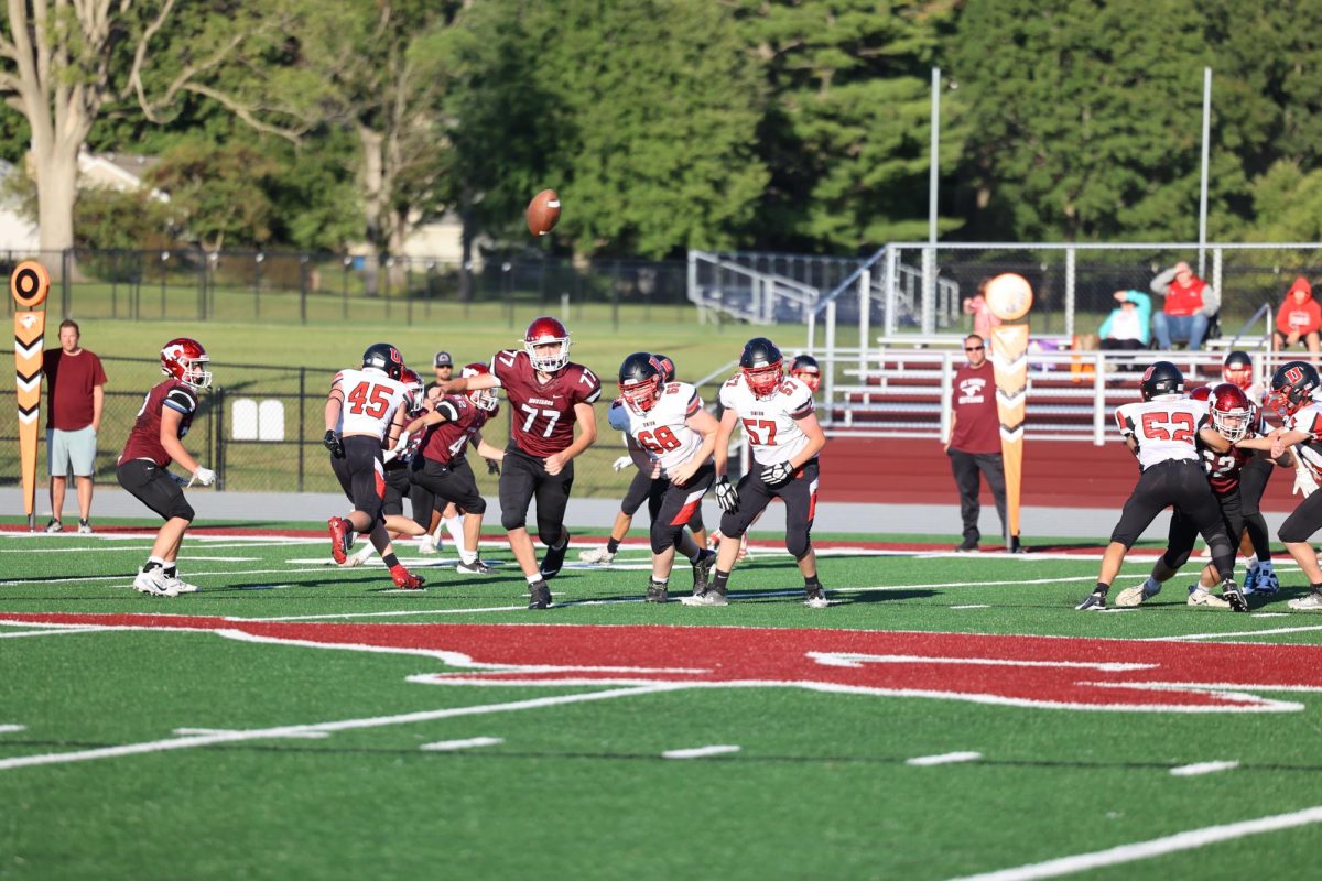 Freshman Ryker Lee (77) goes for the ball while Union players are in pursuit.