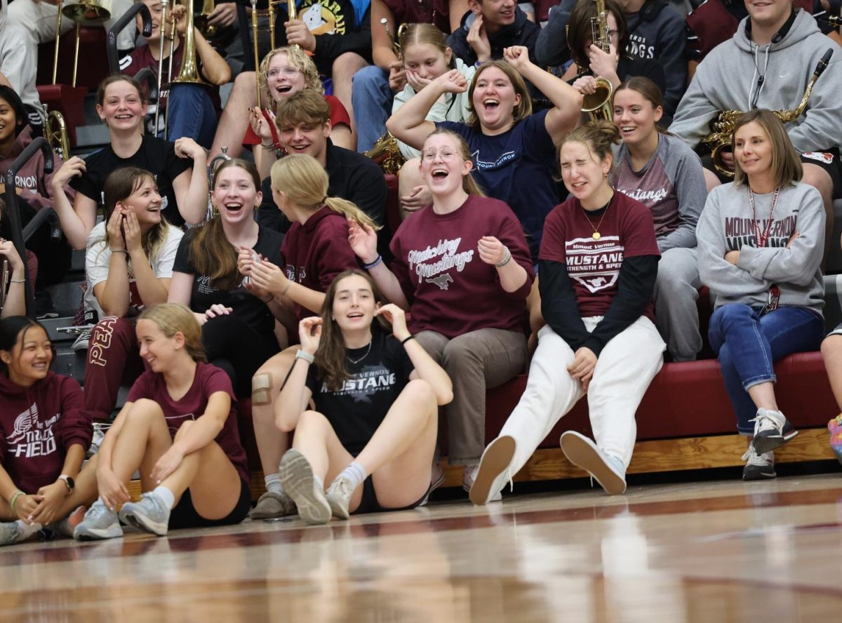 The MVHS students go wild after band seniors successfully complete the marshmallow throwing contest at the Hoco Pep Rally. 