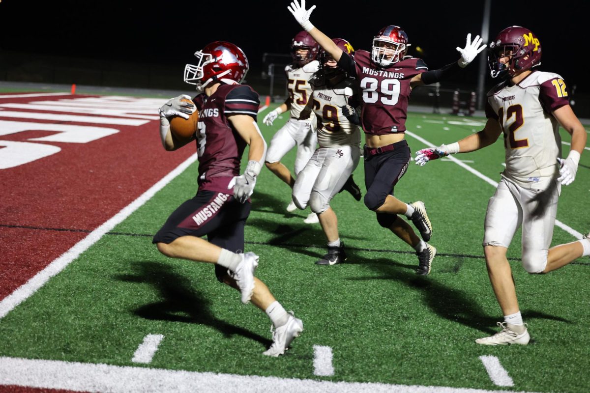 Senior Luke Paulus celebrates as junior Jase Jaspers makes one of his two TDs in the game. Mount Vernon beat Mount Pleasant 59-0 Sept. 27.