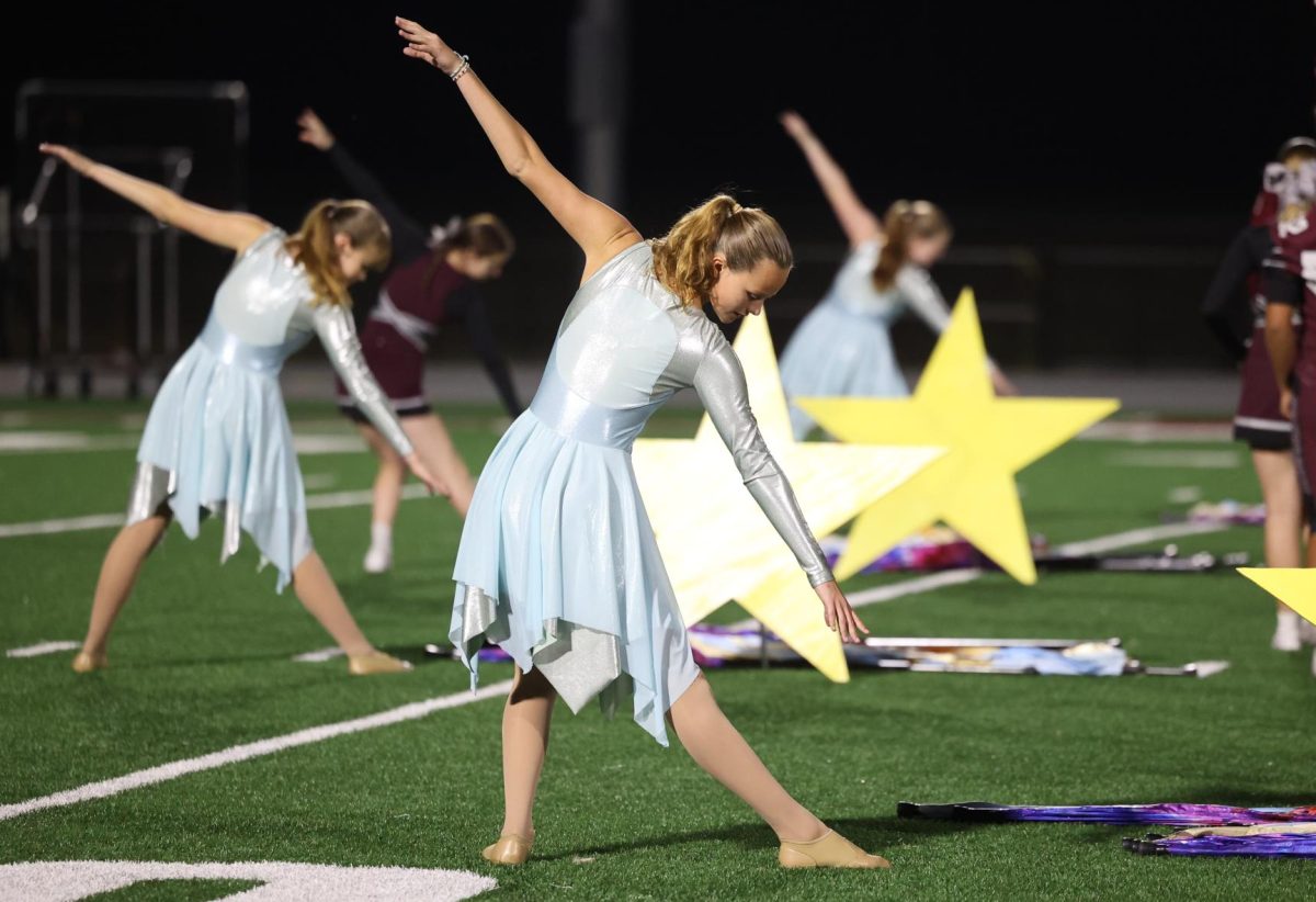 Sophomore Eleanor Dye poses at the beginning of the Marching Mustangs' halftime performance on Oct. 11. 