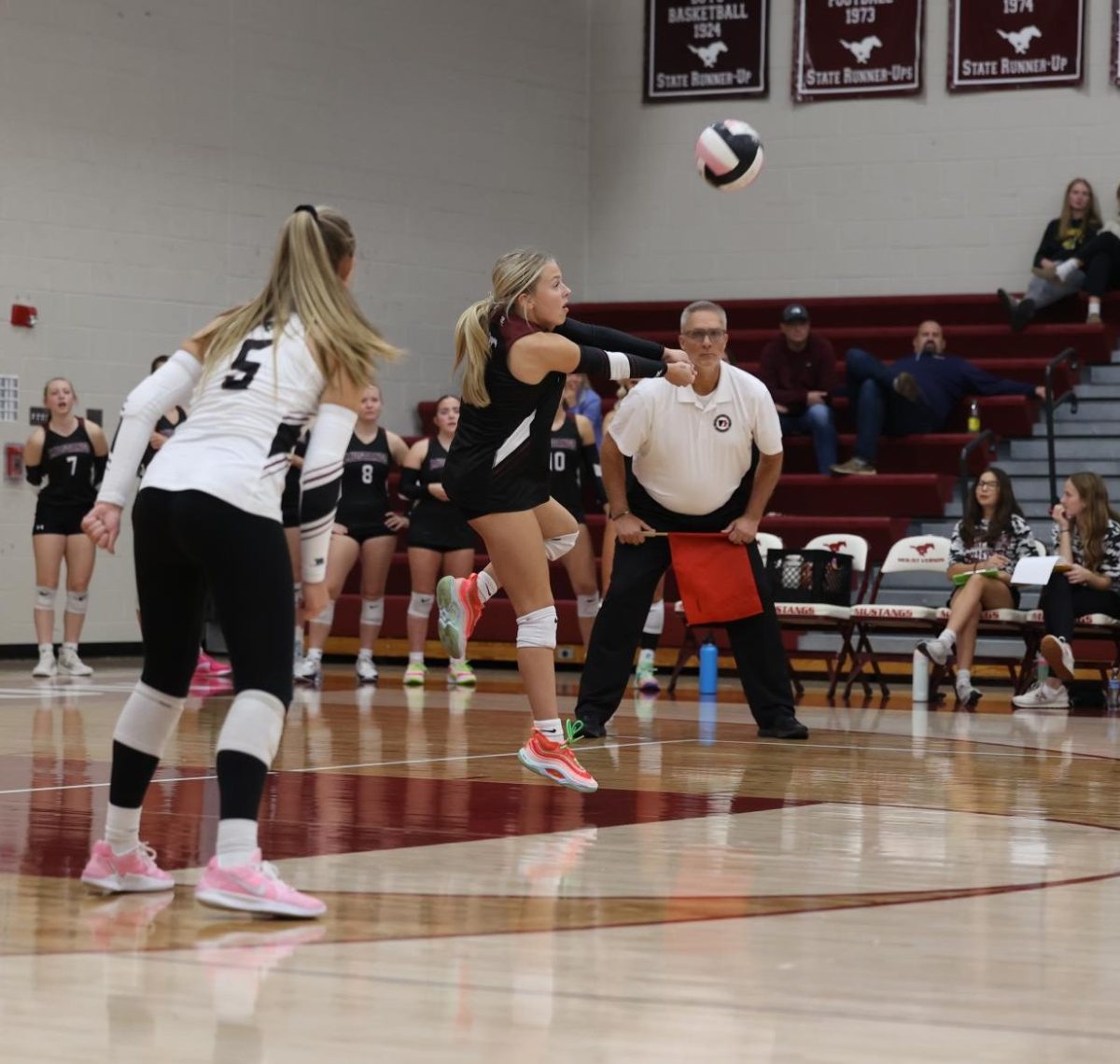 Sophomore Mavrik Schweer (1) balances as she bumps the ball to her teammate Oct. 24.