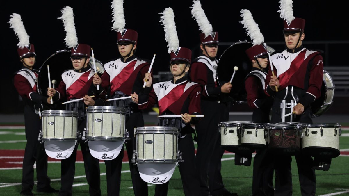 The drumline plays with the Marching Mustangs during their show on Oct. 28. They were undefeated at competitions throughout the entire 2024 season.