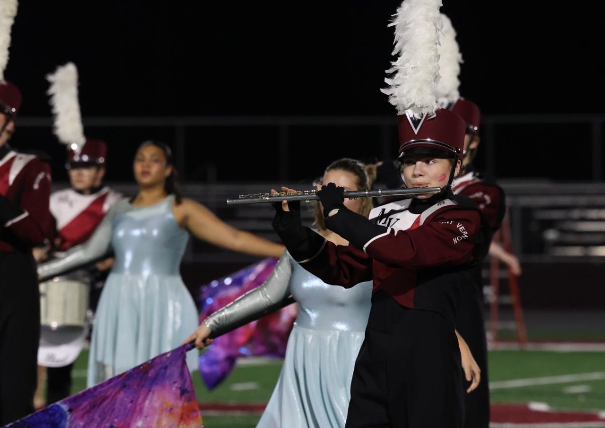 Junior Allie Teague plays along with the marching band during their performance on Oct. 28.