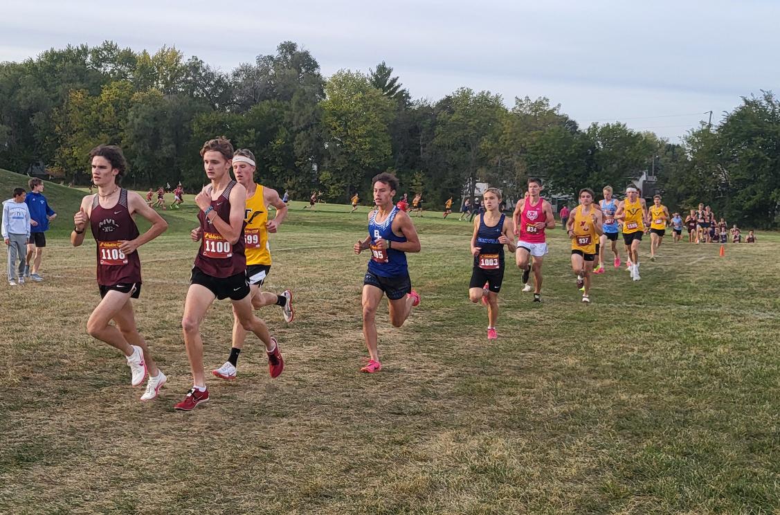 Grady Olberding and Dawson Scheil lead the Varsity boys pack in Williamsburg Oct. 1. Olberding, a senior from Mount Vernon, placed first in the meet running a 15:52. 