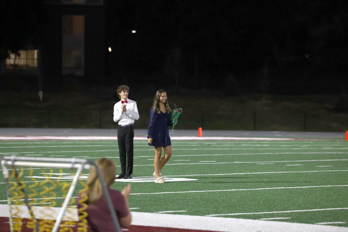 Betsy Louwagie walks to the 50 yard line after being announced Homecoming Queen Sept. 26.