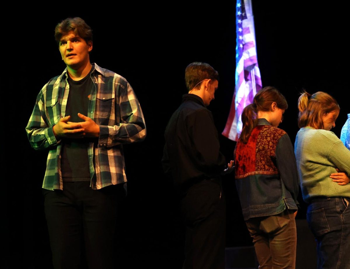 Senior Cyrus Johnson, acting as Joe, speaks during a funeral. 