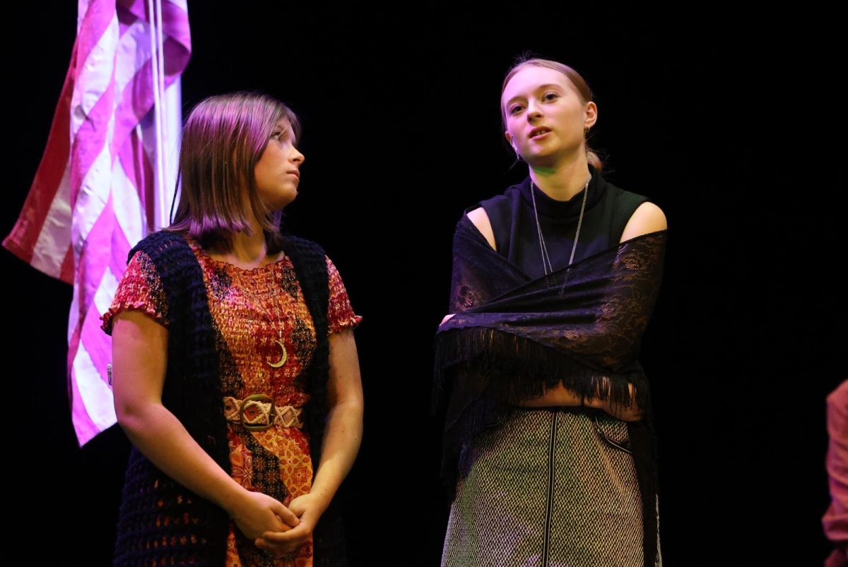 Sophomore Natalee Glaister (Starr) and Junior Claire Thuerauf (Jerriann) discuss their faith and healing during the dress rehearsal on Nov. 7. 