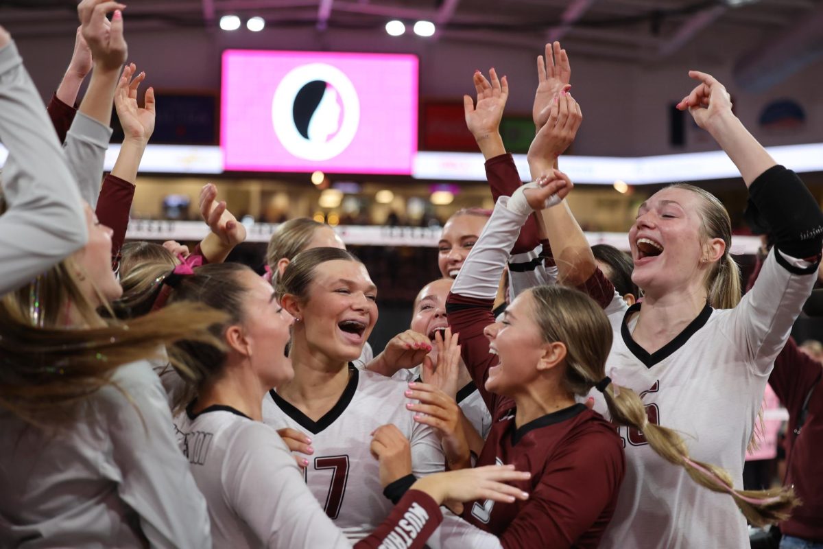 The Mount Vernon varsity Volleyball team gathers to celebrate their first win of the week against Mid-Prairie. Mount Vernon beat Mid-Prairie 3-0 on Nov. 5. 