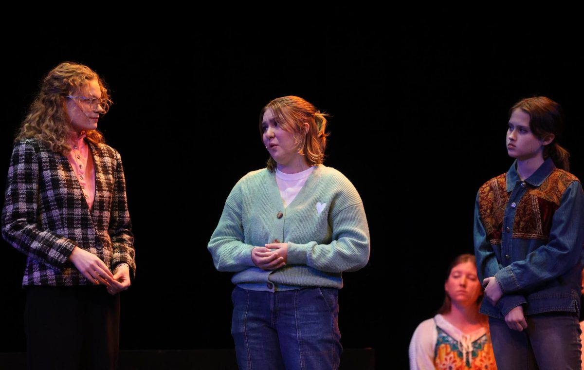 Juniors Allie Teague (Carrie) and Mae Krapfl (Julie) and sophomore Charlotte Woosley (Jenn) talk about the heroics of their children's teacher. 