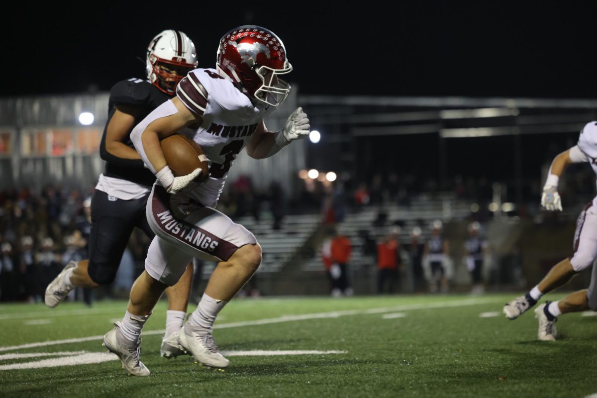 Michael Ryan runs the ball.