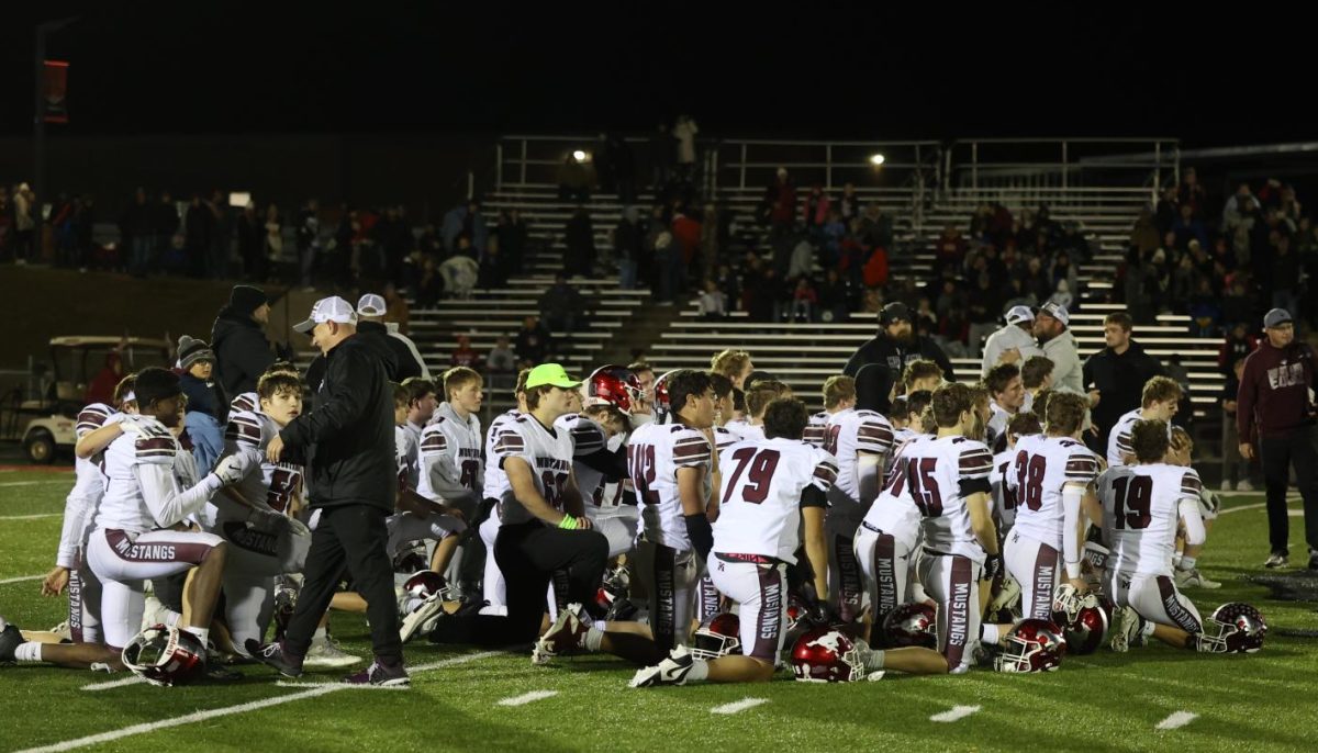 The Mustangs listen to coach after the game. The Mustangs will advance to the semi-finals, playing Humboldt at 7 pm on Nov. 16.