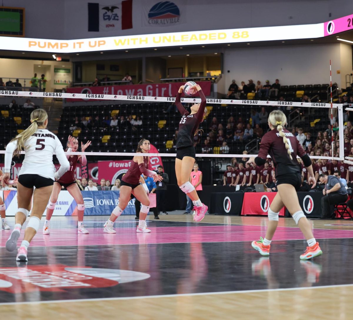 Senior Sydney Huber (15) focuses on the ball as she sets it to her teammates Nov. 7. 