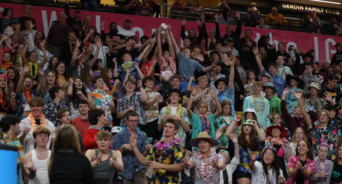 The Mount Vernon student section fight for a free t-shirt as they're being thrown into the crowd Nov. 7.