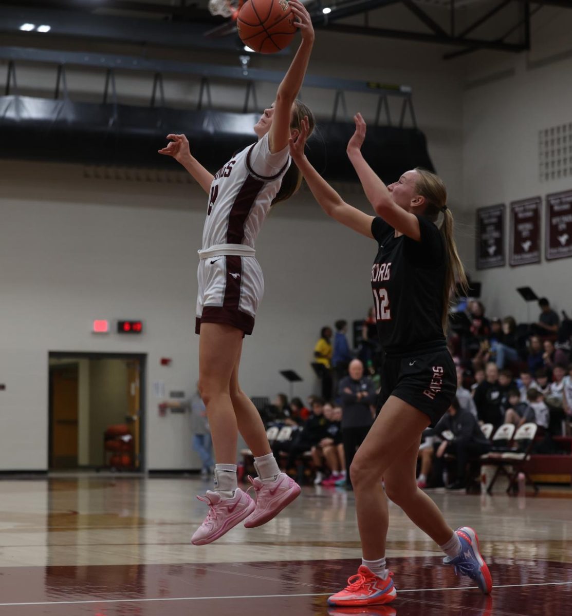 Senior Sydney Huber (23) jumps to receive a pass from her teammate Dec. 13. 