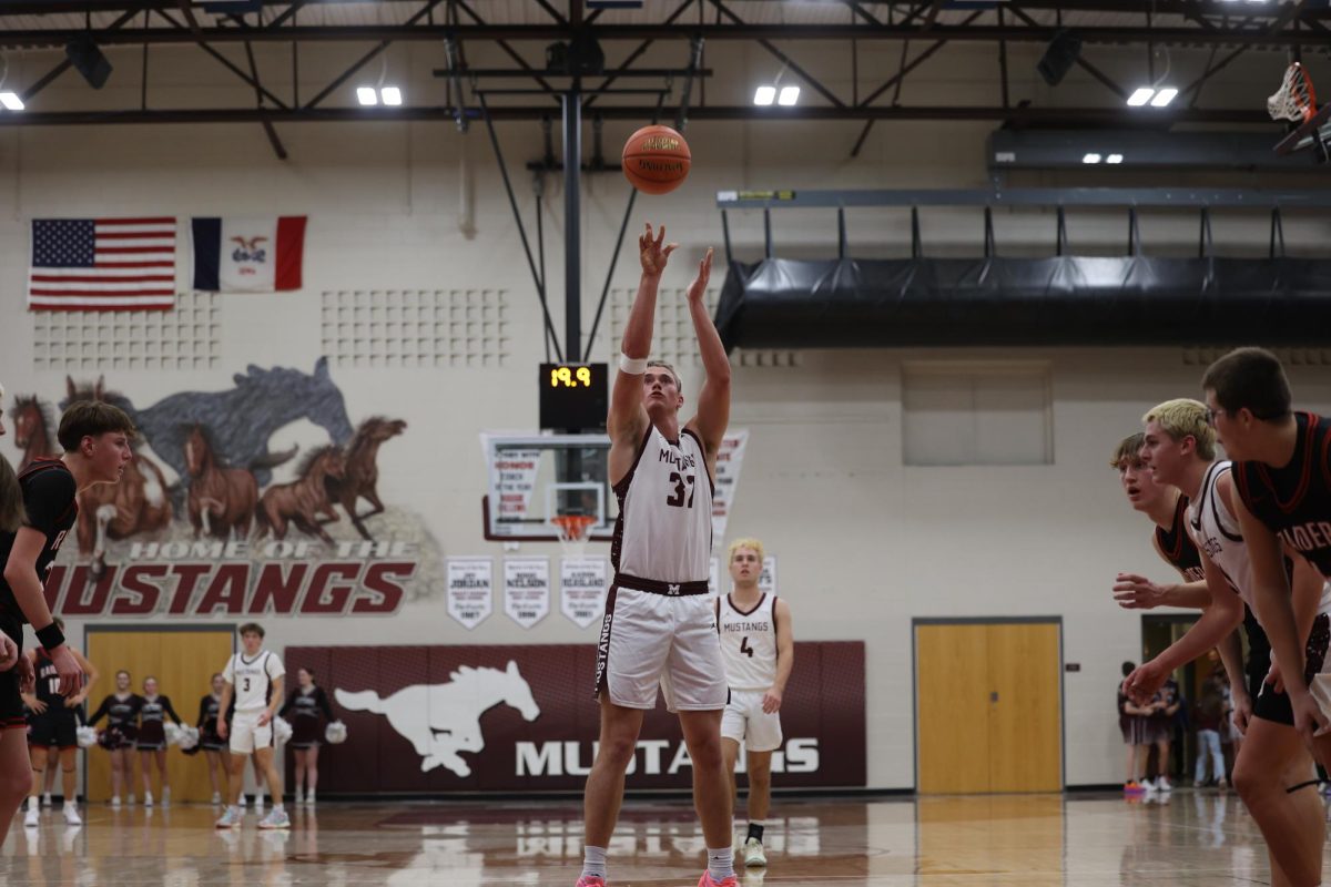 Senior Josef Briesemeister (32) shoots the ball for a free throw Dec. 13.  