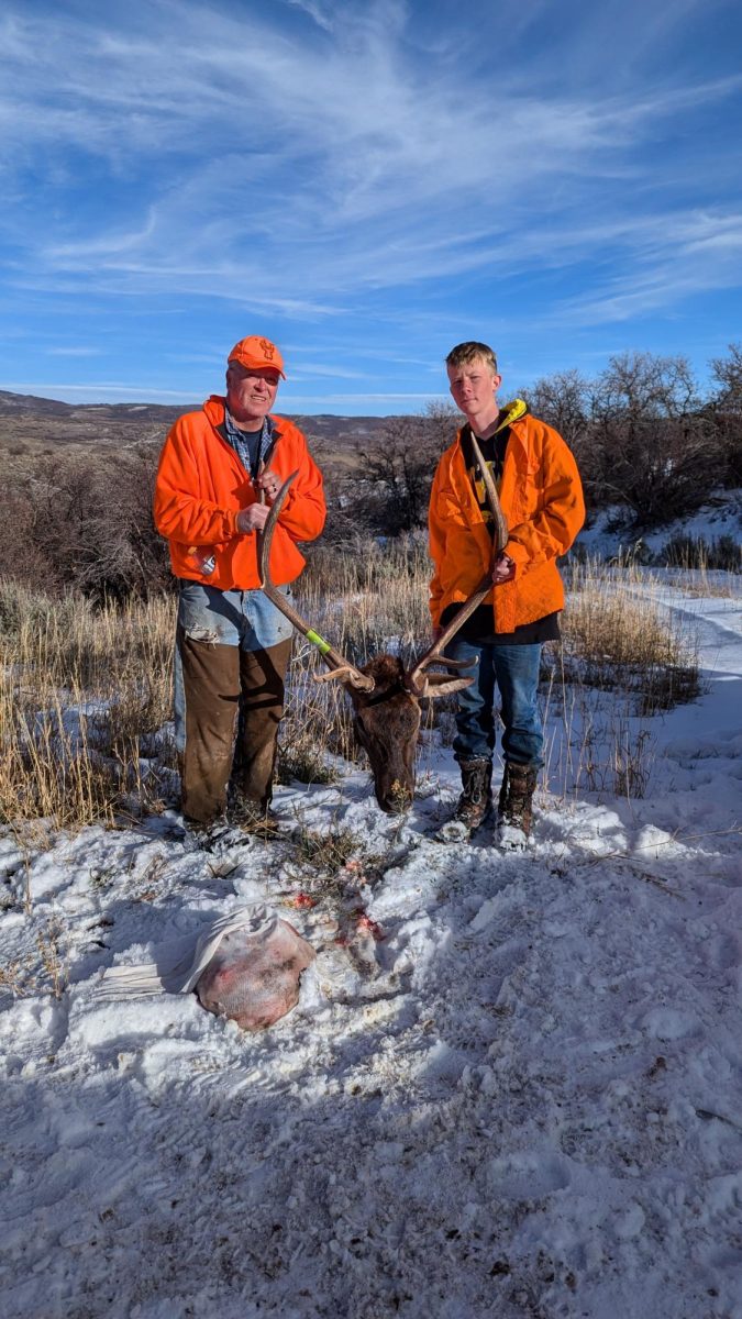 Jacob Alger Posing With His Father With The Elk he Brought Down