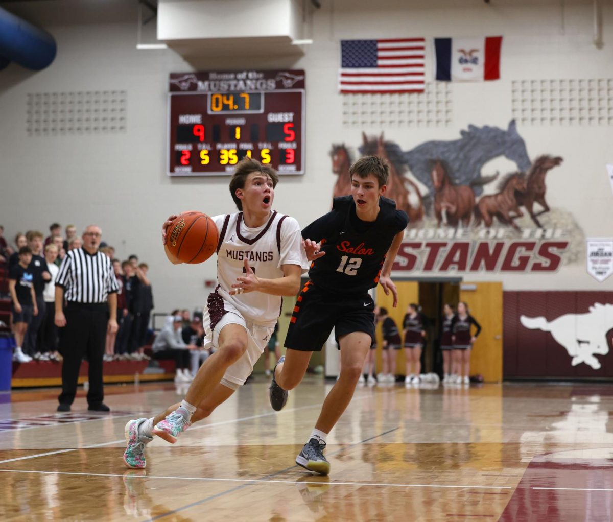 Sophomore Luke Rushford (3) runs with the ball to make a layup Dec. 17.