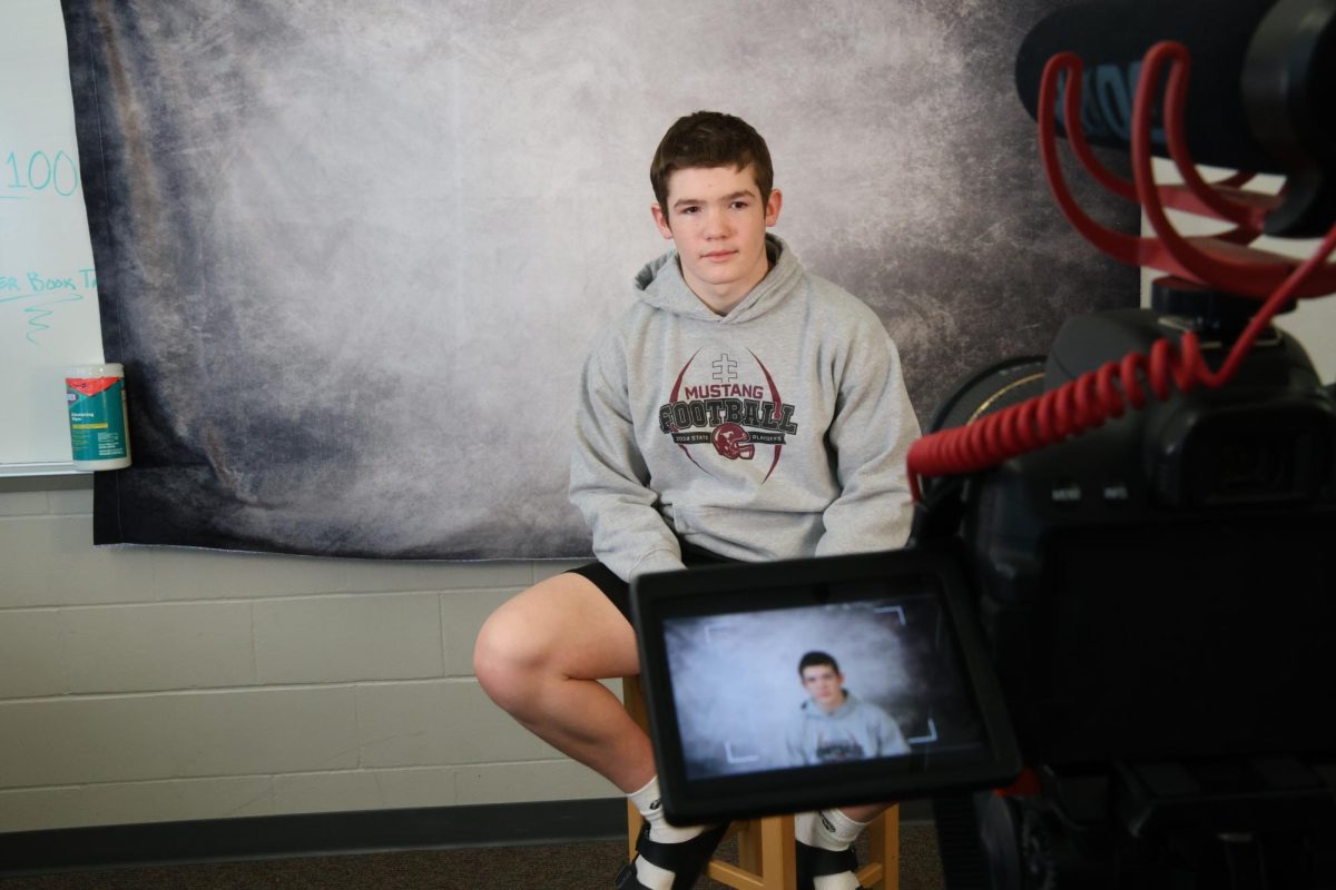 Sophomore Jakob Yock is testing the camera angle to make sure it is in the correct postion for the upcoming interview during his J-Term class, digital media.