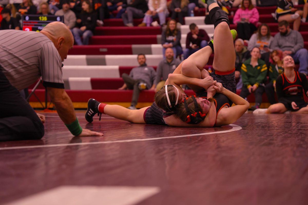 Sophomore Lyla Glaza puts her opponent in a move called the "Cradle" leading to Glaza's pin, Jan. 9. 