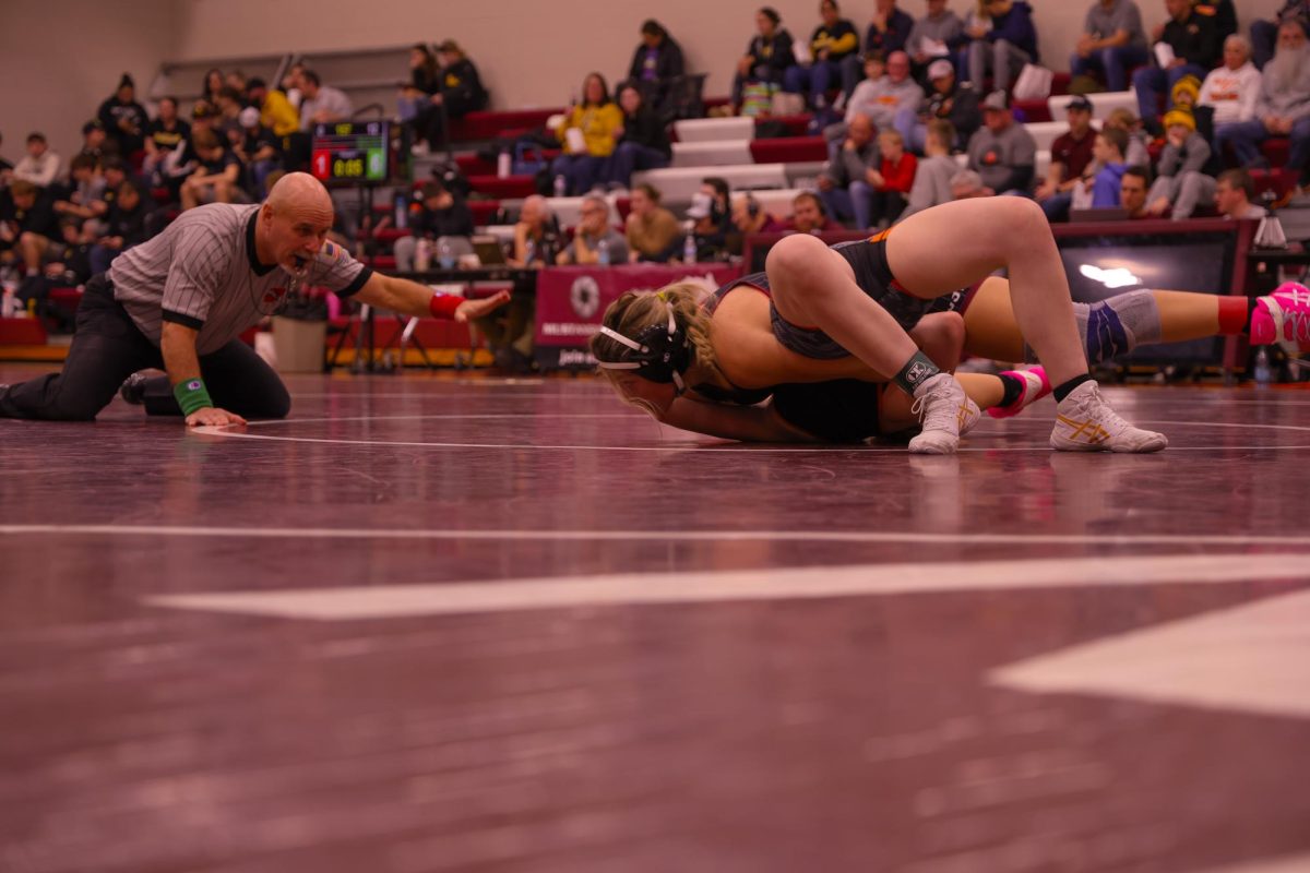 Junior Kaylee Kintzel pins her opponent in Mount Vernon's dual against Grinnell, Jan. 9. 