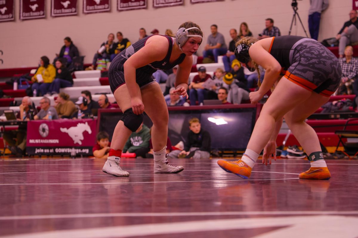 Senior Libby Dix ranked #1 in 190lbs (Class 1A) locks eyes with her opponent before taking her down moments later, Jan. 9. 